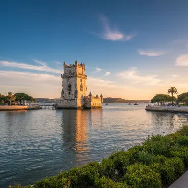 Portugal esim with Belem Tower reflected in water with a blue sky and clouds